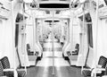 Grayscale shot of an empty metro cabin