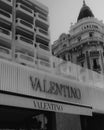 Grayscale shot of the entrance area of Valentino luxury brand store on Cannes boulevard in France