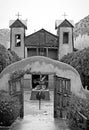 Grayscale shot of the famous historic Sanctuary of Chimayo with a garden in New Mexico, US Royalty Free Stock Photo