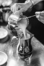 Grayscale shot of a female barista at work preparing Royalty Free Stock Photo