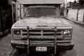 Grayscale shot of the front of a rusty Dodge Ramcharger Truck in Valladolid, Yucatan, Mexico