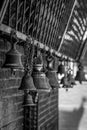 Grayscale shot of hanging bells