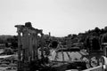 Grayscale shot of a historical scene featuringancient ruins of the Roman Forum