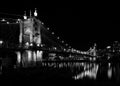 Grayscale shot of the John A. Roebling Suspension Bridge in Covington, Kentucky.