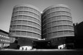 Grayscale shot of a large modern building with two tall towers in Berlin, Germany.