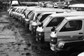 Grayscale shot of minibuses lined up at the Nairobi bus depot in Kenya