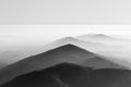 Grayscale shot of the misty Black Mountains in Wales