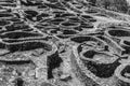 Grayscale shot of the ruins of the ancient Celtic village by the sea in Santa Tecla, Galicia, Spain Royalty Free Stock Photo