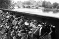 Grayscale shot of the padlocks of love on a Seine river bridge fence in Paris