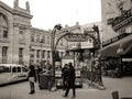 Grayscale shot of people standing in front of the Paris Metro exit near Gare du Nord Royalty Free Stock Photo