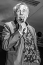 Grayscale shot of Presenter Peter Rapp with a microphone in Hitzendorf, Austria Royalty Free Stock Photo