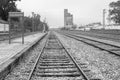 Grayscale shot of railroad tracks at Arroyo Malpartida train station in Extremadura, Spain Royalty Free Stock Photo