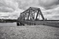 Grayscale shot of The Royal Alexandra Interprovincial Bridge on the Ottawa river in Ottawa, Canada