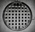 Grayscale shot of a sewer cover at the Eastern State Penitentiary in Philadelphia, Pennsylvania Royalty Free Stock Photo