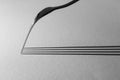 Grayscale shot of the shadow of a fork on a black surface for wallpaper and background