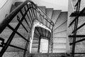 Grayscale shot of stairs going down till the first floor Royalty Free Stock Photo