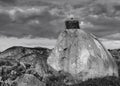 Grayscale shot of a stork in its nest on a rock in a natural area of Marruecos, Spain