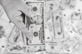Grayscale shot of ten dollars in a hand Royalty Free Stock Photo