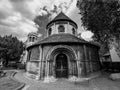 Grayscale shot of a traditional old-styled church in Cambridge