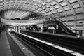 Grayscale shot of a train arriving at the urban Metro rail Washington DC