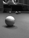 Grayscale shot of a white pool ball on the table Royalty Free Stock Photo