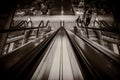 Grayscale top view of escalator railing in a department store