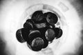 Grayscale top view of a pile of hockey pucks