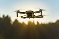 Graz, Austria: 02.01.2020 - Close up shoot of a DJI Quadcopter Drone Mavic mini 249g. Drone flying against sun background