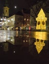 Beautiful Christmas decorations with famous Clock Tower on Herrengasse street, at night, in the