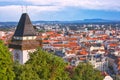 GRAZ, AUSTRIA - July 12th, 2019: Aerial view to the city of Graz with Clock tower, the symbol og the city, and the Town hall below