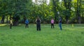 Graz/Austria - June 24, 2019: People doing yoga and sports in the park, in summertime