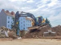 Graz, Austria-17.08.2020: Yellow industrial excavator working on demolition/construction site