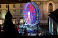 Graz with church Mariahilf and christmas fair with ferris wheel