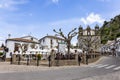 Grazalema, Cadiz, Spain - May 1, 2022: Main square with bar terraces of Grazalema village, Grazalema mountains, one of the