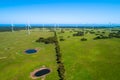 Grazelands and wind farm near the ocean. Royalty Free Stock Photo