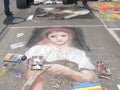 Grazie di Curtatone, 15/08/2012: pavement street artist painting over the asphalt in Madonnari competition of chalk paintings, at