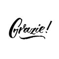 Grazie - thank you in Italian. Calligraphy inscription, black word on white background. Handwritten note