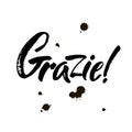 Grazie - thank you in Italian. Calligraphy inscription, black word on white background. Handwritten note