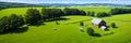 A grazing sheep panorama of verdant rolling countryside typical of England. Generative AI.