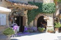 People resting in small restaurant in medieval castle. Grazzano