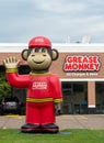 Grease Monkey Automotive Repair Facility and Trademark Logo