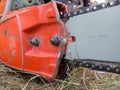 Greasy chain and blade of old used petrol chainsaw, covered with sawdust after cutting work