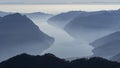 Great aerial landscape at lake Iseo in winter season. Foggy and humidity in the air. Panorama from Monte Pora, Italian Alps Royalty Free Stock Photo