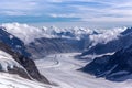 Great Aletsch glacier and Bernese Alps and jungfrau snow mountain peak  with blue sky background view from Jungfraujoch top of Royalty Free Stock Photo