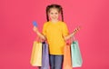 Great App. Happy Little Girl Holding Shopping Bags, Smartphone And Credit Card Royalty Free Stock Photo