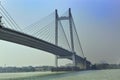 A great architecture of giant bridge with blue vivid sky and green blue water