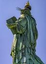 Great back vertical photo of the Statue of Liberty holding her torch on a sunny day in Manhattan. Royalty Free Stock Photo