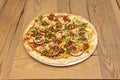 Great BBQ pizza with raw red onion rings and lots of parsley. Minced meat with tomato Royalty Free Stock Photo