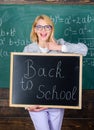 Great beginning of school year. Top ways to welcome students back to school. Teacher woman hold blackboard inscription Royalty Free Stock Photo