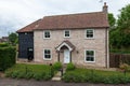 Modern detached brick house front and garden Royalty Free Stock Photo